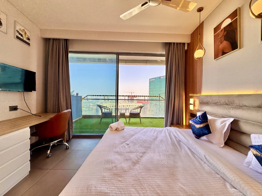 Skyline Stay 23 premium bedroom interior with king bed at Supernova Spira Sector 94 Noida