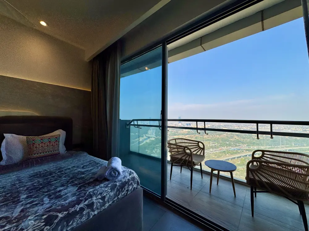 Panorama 32 bedroom with smart TV workspace Mulberry Homes Noida