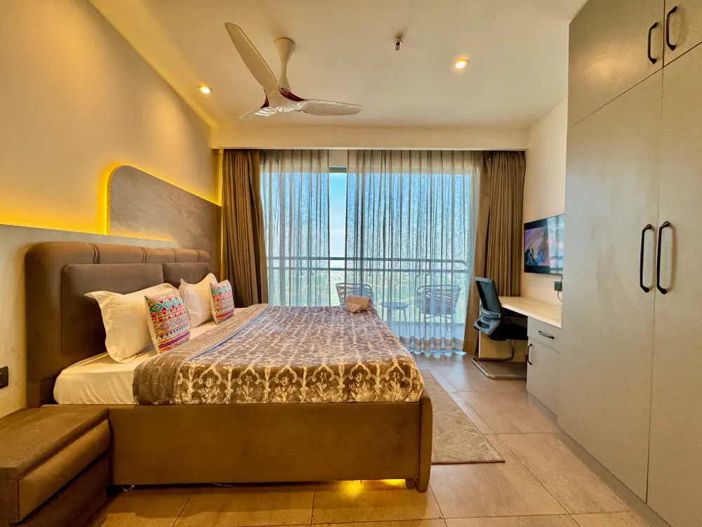 Panorama 32 modern bedroom with TV luxury apartment Noida